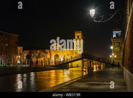 The Torri dell' Arsenale (Towers of the Arsenal) and the Rio dell' Arsenale canal from the Fondamenta Arsenale at night, Venice, Italy Stock Photo