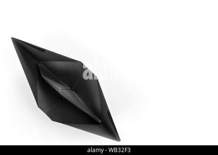 Black paper boat top view isolated on white with copy space Stock Photo