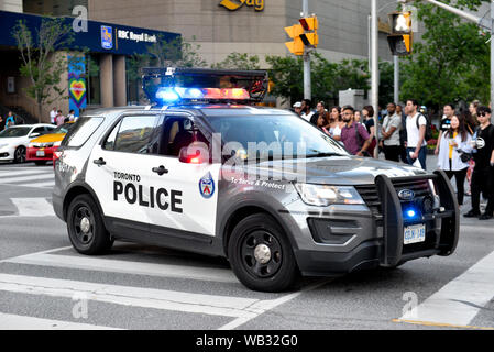 Toronto, ON, Canada - JUNE 21, 2019: Police car during the demonstration of the street of Toronto at Trans March and Pride Month. Stock Photo