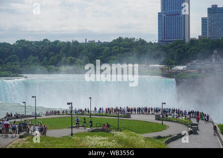 Niagara Falls, NY: Tourists view the Horseshoe Falls from Prospect Point, on the American side of the Niagara Gorge, across from Table Rock in Canada. Stock Photo