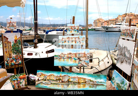 You'll discover many local artists along the waterfront of the St Tropez harbour where you can purchase lovely local paintings Stock Photo