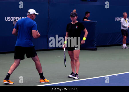 Flushing Meadows, New York, United States - 23 August 2019. Romania's Simona Halep works with a member of her team while practicing at the National Tennis Center in Flushing Meadows, New York in preparation for the US Open which begins next Monday.  Though Halep won Wimbledon, she is seeded 4th at the US Open. Credit: Adam Stoltman/Alamy Live News Stock Photo