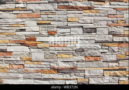 Close-up of Colorful Stone Wall Background Texture Stock Photo