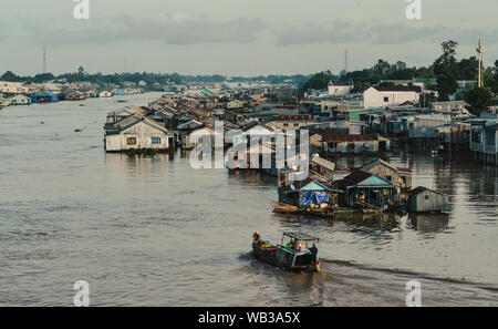 Floating houses on Mekong River in Chau Doc, Vietnam. Chau Doc is a city in the heart of the Mekong Delta, in Vietnam. Stock Photo