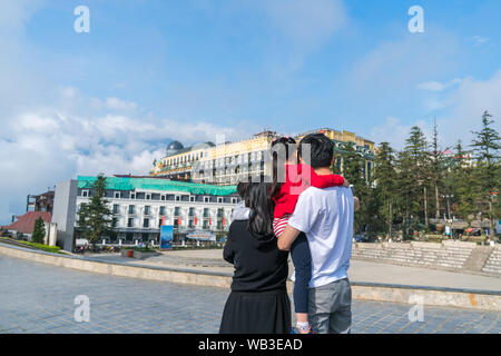 Travel family taking selfie on street in Sapa town, Vietnam Stock Photo