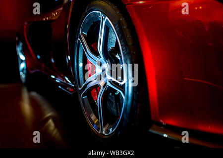 Close Up on beautiful modern supercar with dramatic lighting Stock Photo