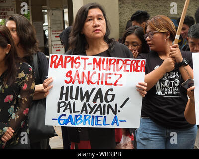 Manila, Philippines. 23rd Aug, 2019. A protester holds a placard in front of the Department of Justice during the demonstration.GABRIELA Alliance of Women, together with other women formations, held a protest in front of the Department of Justice in Manila to show their opposition to any move to release former Calauan, Laguna Mayor Antonio Sanchez from prison under RA 10592, a new law that adjusts the Good Conduct Time Allowance rule under the Revised Penal Law. Credit: SOPA Images Limited/Alamy Live News Stock Photo