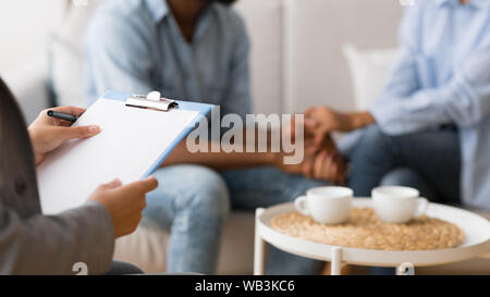 Unrecognizable Afro Spouses Talking Holding Hands On Marital Therapy Session Stock Photo