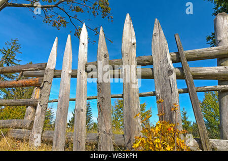 Old wooden picket fence  in the country on a sunny day Stock Photo
