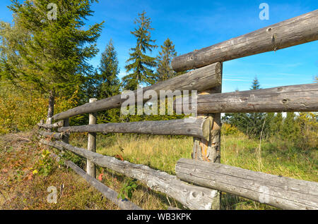 Wooden fence of planks in the country on a sunny day Stock Photo