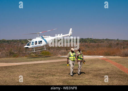 Victoria Falls, Zimbabwe - August 2 2019: Zambezi Helicopters Aircraft Starting for Victoria Falls Sightseeing Flight called Flight of Angels over the Stock Photo