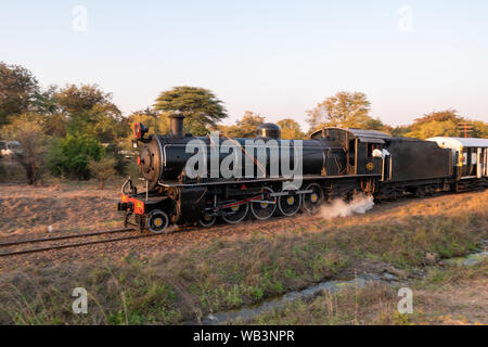 Victoria Falls, Zimbabwe - August 2 2019: Steam Train with Engine at Victoria Falls, pulled by Zambia Railways Steam locomotive 204. Stock Photo