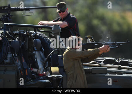 Enthusiasts at the Tanks, Trucks and Firepower show, in the village of Dunchurch in Warwickshire. Stock Photo