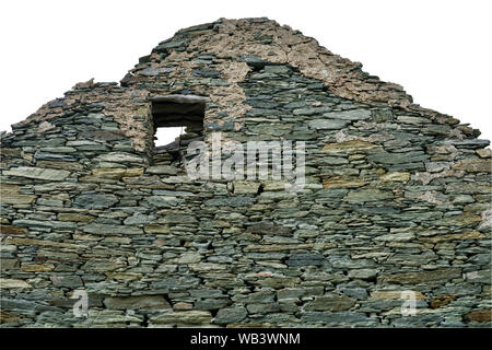 Isolated ruin of a natural stone wall of a morbid home Stock Photo