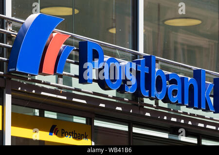 Stade, Germany - August 22, 2019: Signage above entrance identifying a Postbank bank branch Stock Photo