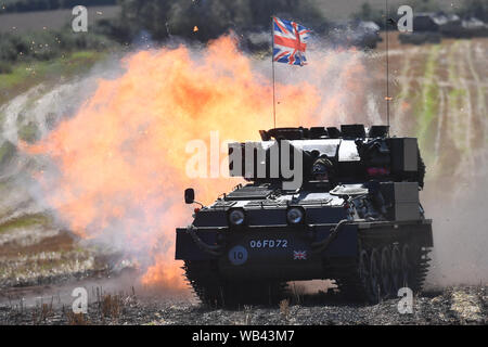 Enthusiasts at the Tanks, Trucks and Firepower show, in the village of Dunchurch in Warwickshire. Stock Photo