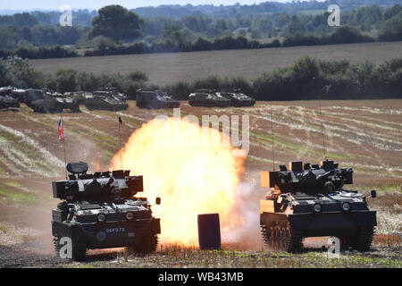 Enthusiasts at the Tanks, Trucks and Firepower show, in the village of Dunchurch in Warwickshire. Stock Photo