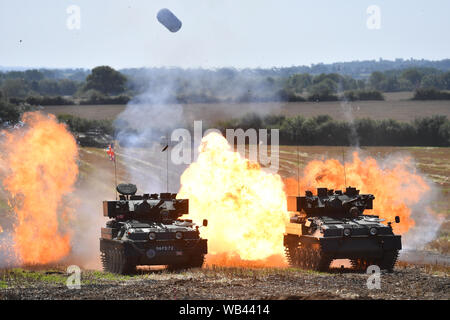 Enthusiasts at the Tanks, Trucks and Firepower show, in the village of Dunchurch in Warwickshire. Stock Photo