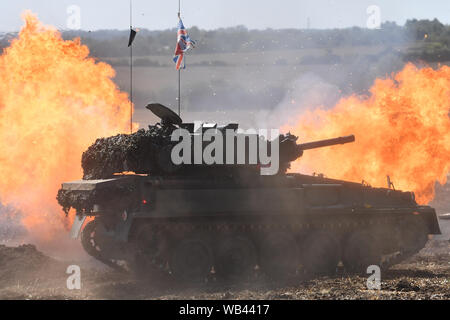 Enthusiasts at the Tanks, Trucks and Firepower show, in the village of Dunchurch in Warwickshire. Stock Photo