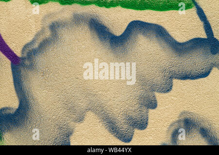 Distressed Yellow Brown stucco Wall With Graffiti Street Art. Background And Painted Lines And Draw. Stock Photo