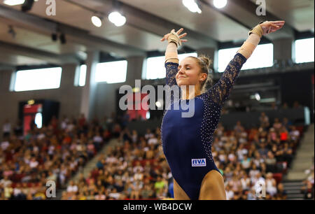 Stuttgart, Germany. 24th Aug, 2019. Gymnastics: 1st World Cup qualification, women in the Scharrena Stuttgart. Emelie Petz is happy about the lead after her jump. Credit: Christoph Schmidt/dpa/Alamy Live News Stock Photo