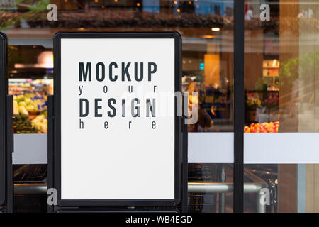 Mockup advertising board in front  of supermarket. Mock up billboard for your text messege or mock up content with department store or shopping mall b Stock Photo