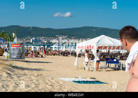 Sunny Beach, Bulgaria July 15, 2019. Crowd of tourists on the Black Sea beach, in Sunny Beach, Bulgaria, on a beautiful hot summer day. Stock Photo