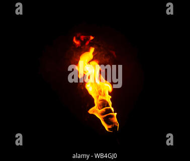flame of a torch in the dark on a black background, only the fire is visible Stock Photo