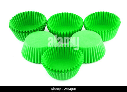 Green silicone form for cooking muffin and cupcake on white background. Molds for sweet and delicious muffins. Stock Photo