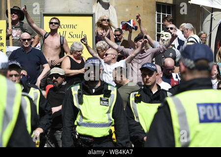 Tommy Robinson supporters chant slogans during the rally.Supporters gathered outside BBC to demand the freedom of their jailed right-wing leader Stephen Yaxley-Lennon aka Tommy Robinson. During the rally, police had to intervene and raise their batons when a Police van was attacked by the Tommy Robinson supporters. A person was arrested after the confrontation. Stock Photo