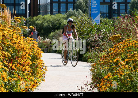 August 23, 2019, London, United Kingdom: A woman rides a bicycle on a hot summer day in London, UK. (Credit Image: © Dinendra Haria/SOPA Images via ZUMA Wire) Stock Photo