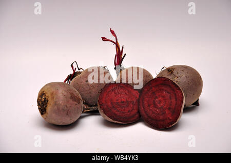 whole and sliced beetroots on a seamless background Stock Photo