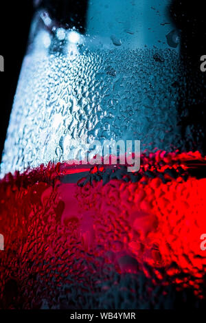 Detail of glass with red drink, cold, drops, background close up Stock Photo