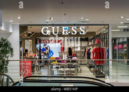 Guess outlet retailer store interior. Clothing brand store with prices at MEGA Outlet shopping mall in Thessaloniki Greece Stock Photo - Alamy