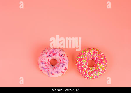 Round pink donut on pink background copy spase for text Stock Photo