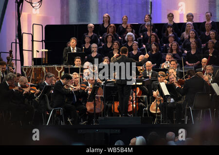 Berlin, Germany. 24th Aug, 2019. The Berliner Philharmoniker, conducted by the new chief conductor Kirill Petrenko (M), will play an open-air concert at the Brandenburg Gate. Credit: Paul Zinken/dpa/Alamy Live News Stock Photo