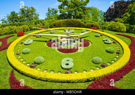 Flower clock in Geneva, Switzerland. L'horloge fleurie in French, outdoor flower clock located on the western side of Jardin Anglais park. Created in 1955 as a symbol of the city's watchmakers. Stock Photo