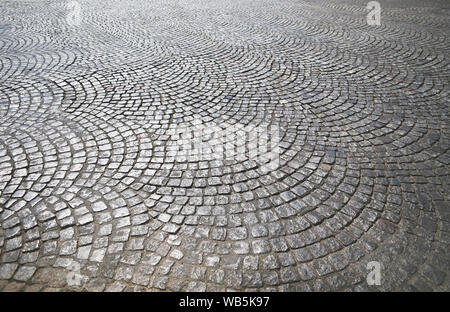 Gray stone road surface shiny, cobbled road, cobble surface Stock Photo