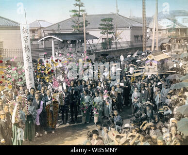 [ 1890s Japan - Japanese Funeral Procession ] —   A funeral procession. The mourners carry large clusters of artificial flowers.  19th century vintage albumen photograph. Stock Photo