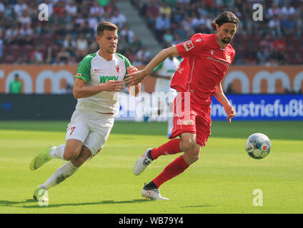 Augsburg, Germany. 24th Aug, 2019. Neven Subotic (R) of Union Berlin vies with Florian Niederlechner of Augsburg during a German Bundesliga match between FC Augsburg and 1. FC Union Berlin in Augsburg, Germany, on Aug. 24, 2019. Credit: Philippe Ruiz/Xinhua Credit: Xinhua/Alamy Live News Stock Photo