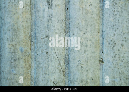 The texture of the concrete wall with a wavy structure. Background. Stock Photo