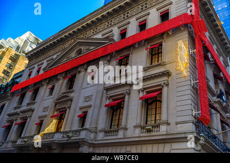 New York, USA - December 07, 2018: Christmas lights decorations of red ribbon and jaguar the Cartier store on Fifth Avenue in Manhattan, New York, USA Stock Photo