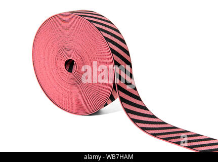 Roll of decorative elastic ribbon in red and black with alternating diagonal stripes displayed at an angle on white with copy space Stock Photo