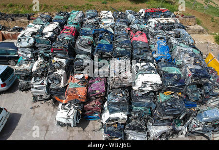 Cars in junkyard, pressed and packed for recycling. Car recycling