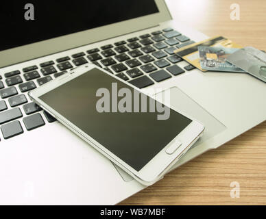 smartphone and credit card  on keybord. shopping online. Stock Photo