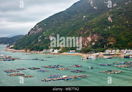 View of the fish farms and restaurants at Sok Kwu Wan (Picnic Bay). Lamma Island, Hong Kong, China. Stock Photo