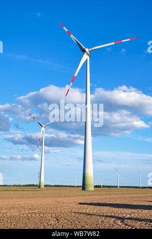 Wind wheels in a barren field seen in Germany Stock Photo - Alamy