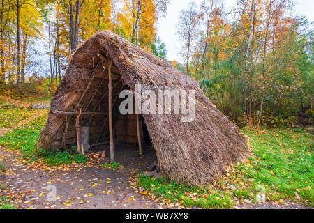Grass straw hut on a meadow and beautiful autumn colours Stock Photo