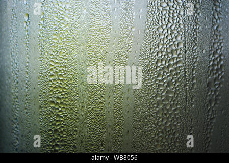 Transparent glass steamed with steam, condensation of water and small ...