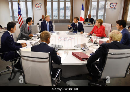 Canada's Prime Minister Justin Trudeau, Britain's Prime Minister Boris Johnson, Germany's Chancellor Angela Merkel, European Council President Donald Tusk, France's President Emmanuel Macron, Italy's Prime Minister Giuseppe Conte, Japan's Prime Minister Shinzo Abe and US President Donald Trump meet for the first working session of the G7 Summit in Biarritz, France. Stock Photo